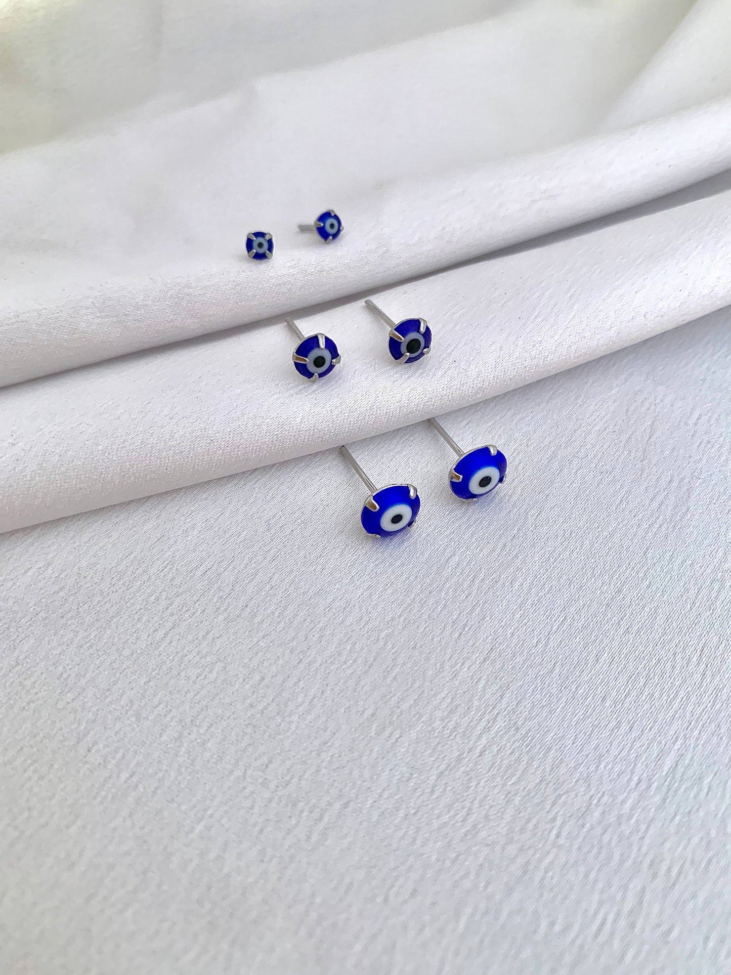 Brinquinho olho grego azul de aço inox - Antialérgicos